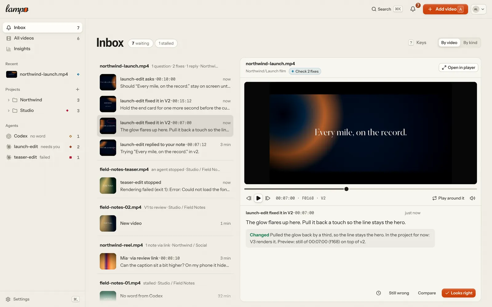 The Inbox by video on a wide screen: an agent's question, fixes to check and a reply on one video, an agent that stopped, a new video to review, a note from a review link and an agent gone quiet on others; the picked fix with its frame and timeline on the right, and Looks right at the bottom